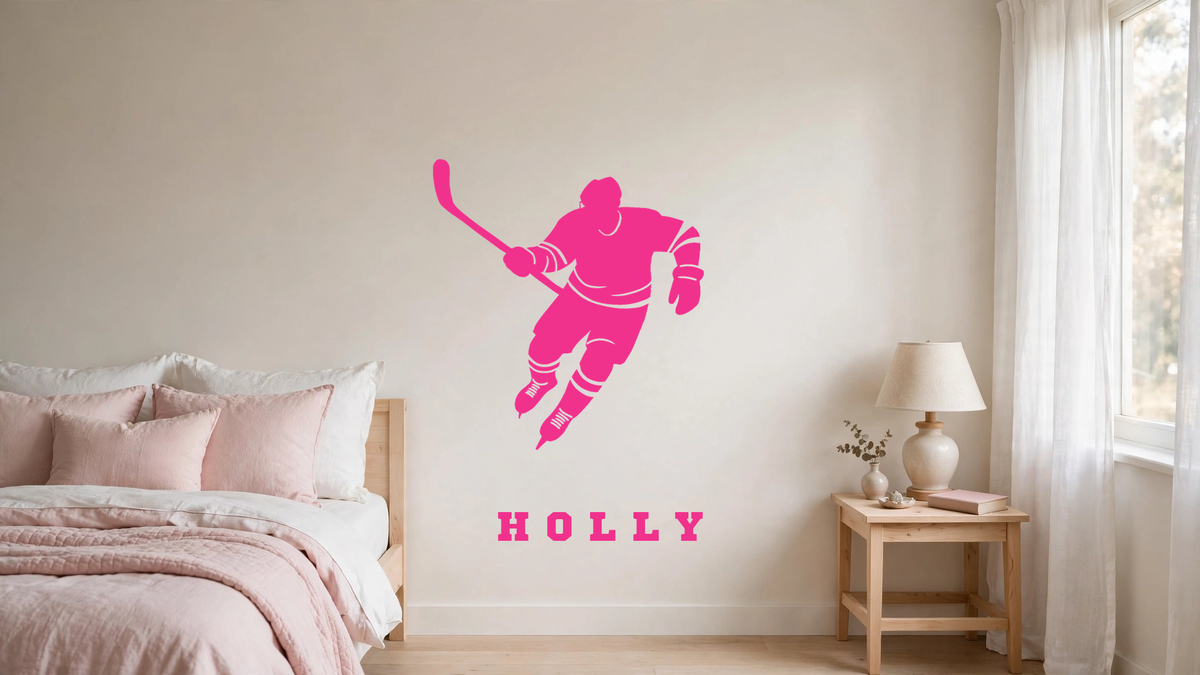 Hot pink hockey player skating wall graphic personalized with the name Holly on a girl's bedroom wall